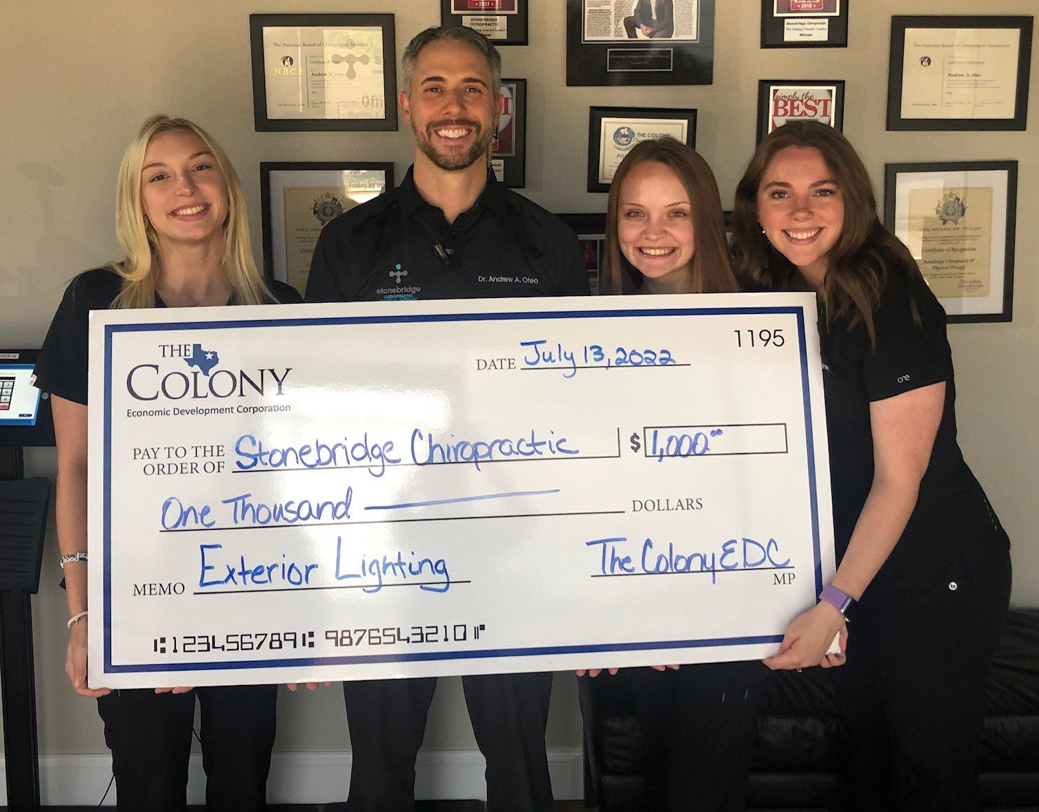 The Colony Economic Development Corporation presenting an exterior lighting grant to Stonebridge Chiropractic